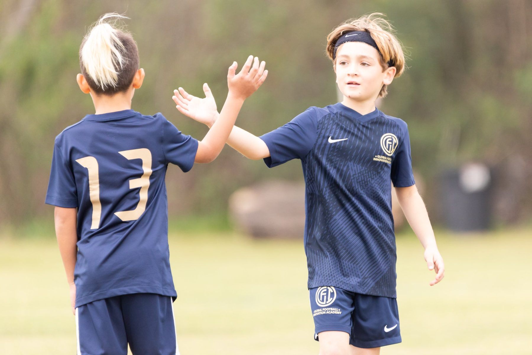 Two GFI players high-fiving
