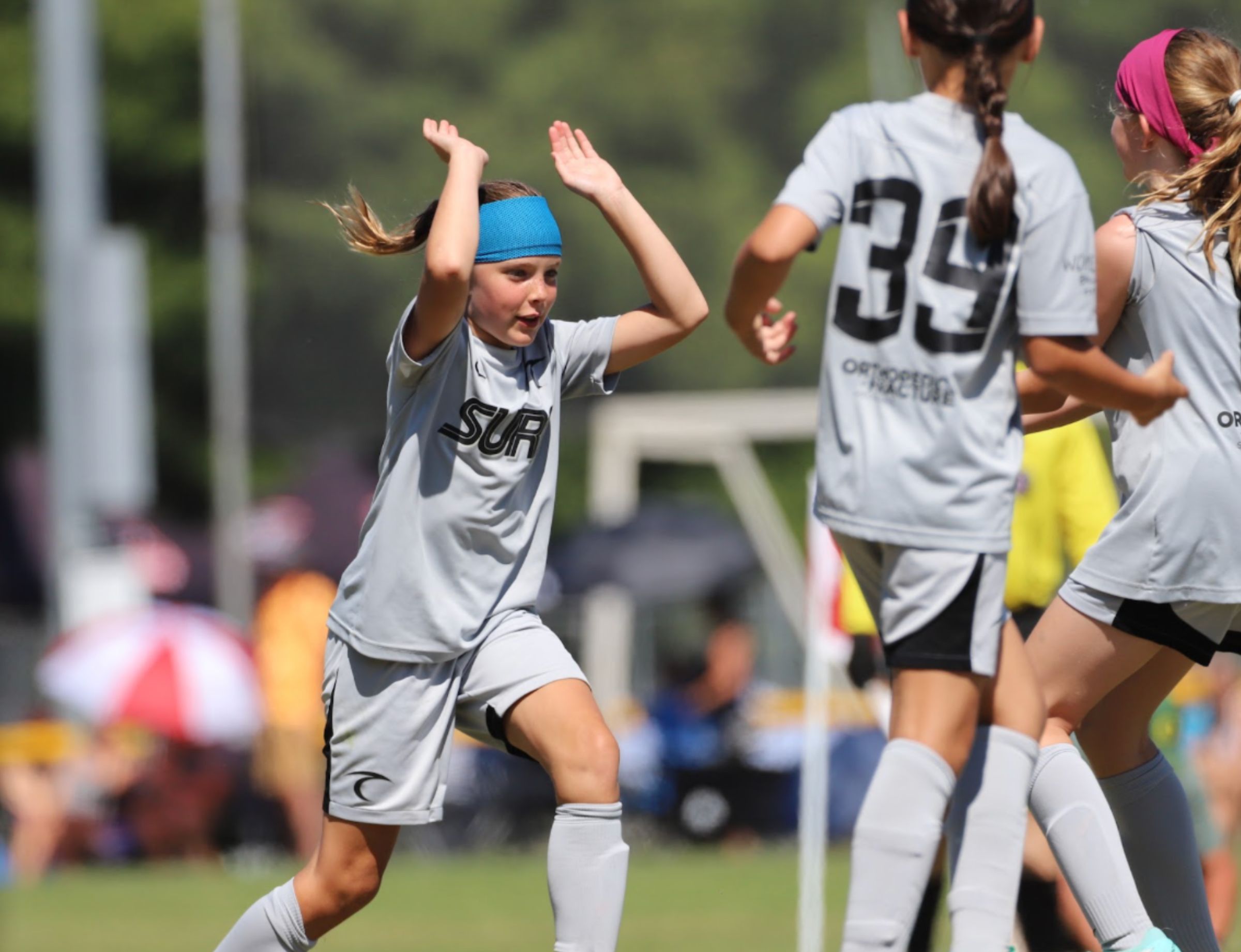 Oregon Surf girls celebrating a goal